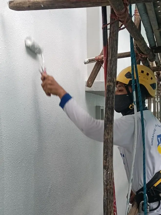 Finishing coat application during external repainting works