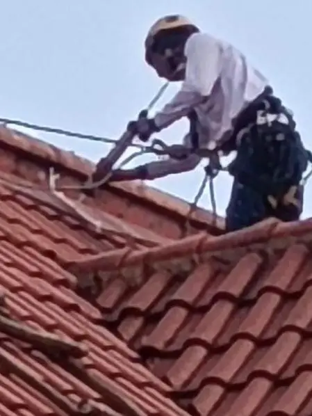 Sealant works to a roof joint during MCST repair works